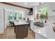 Well-lit kitchen with stainless steel appliances, light cabinets, hardwood floors, and butcher block island at 1637 Pinckney Park Dr, Charleston, SC 29407