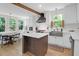 Spacious kitchen with ample countertops, stainless appliances, butcher block island, and light filled windows at 1637 Pinckney Park Dr, Charleston, SC 29407