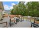 Outdoor seating on back porch with wood-look decking and comfortable chairs at 1726 Waterbrook Dr, Charleston, SC 29414