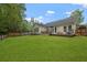 Expansive backyard featuring a well-maintained lawn and a charming deck with seating at 1726 Waterbrook Dr, Charleston, SC 29414
