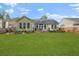 Expansive backyard featuring a well-maintained lawn and a charming deck with seating at 1726 Waterbrook Dr, Charleston, SC 29414