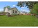 Expansive backyard featuring a well-maintained lawn and a charming deck with seating at 1726 Waterbrook Dr, Charleston, SC 29414