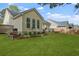 Expansive backyard featuring a well-maintained lawn and a charming deck with seating at 1726 Waterbrook Dr, Charleston, SC 29414