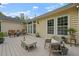 Back patio with neutral-toned furnishings and leafy plants, ideal for relaxing outdoors at 1726 Waterbrook Dr, Charleston, SC 29414