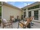 Backyard patio, perfect for relaxing and entertaining, with seating arranged around a central table at 1726 Waterbrook Dr, Charleston, SC 29414