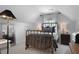 A well-lit bedroom features a metal frame bed, complemented by matching nightstands and lamps at 1726 Waterbrook Dr, Charleston, SC 29414