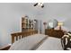 Comfortable bedroom featuring a bed, a dresser, a mirror, and a bookcase at 1726 Waterbrook Dr, Charleston, SC 29414