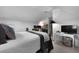 A spacious bedroom showcasing a well-dressed bed with bedside tables and a bright desk area at 1726 Waterbrook Dr, Charleston, SC 29414
