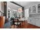 Bright breakfast nook featuring a round table, bench seating, and view to the kitchen at 1726 Waterbrook Dr, Charleston, SC 29414