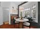 Cozy breakfast nook with a round table, built-in bench, and charming bay window at 1726 Waterbrook Dr, Charleston, SC 29414