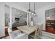 Dining area with a wooden table, contemporary light fixture, and views of the living room at 1726 Waterbrook Dr, Charleston, SC 29414