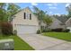 Attached garage to the side with a long driveway, perfect for multiple vehicles at 1726 Waterbrook Dr, Charleston, SC 29414
