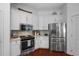 Well-equipped kitchen features stainless steel appliances, stylish tile backsplash, and ample cabinet space at 1726 Waterbrook Dr, Charleston, SC 29414