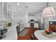 Lovely kitchen features stainless appliances, white cabinets and countertops, with an open floorplan to the dining area at 1726 Waterbrook Dr, Charleston, SC 29414