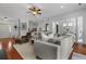 Comfortable living room featuring a sectional sofa and hardwood floors, offering ample seating at 1726 Waterbrook Dr, Charleston, SC 29414