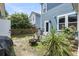 Cozy backyard featuring a fire pit with chairs, mature greenery, and a fenced-in yard at 1814 Grovehurst Dr, Charleston, SC 29414