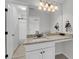 Bright bathroom featuring granite countertops, neutral walls, large mirror and view to shower and toilet room at 1814 Grovehurst Dr, Charleston, SC 29414