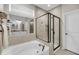 Luxurious bathroom features a soaking tub, separate glass-enclosed shower, and double vanity with stylish mirrors at 1814 Grovehurst Dr, Charleston, SC 29414