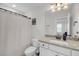 Bathroom with granite countertop vanity, white cabinets, and shower with white curtain at 1814 Grovehurst Dr, Charleston, SC 29414