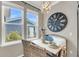 Charming dining area with a rustic table, decorative clock, and natural light streaming through the windows at 1814 Grovehurst Dr, Charleston, SC 29414