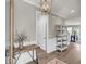 Welcoming foyer featuring hardwood floors, a decorative table, and stylish lighting at 1814 Grovehurst Dr, Charleston, SC 29414