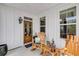 Cozy front porch with wooden rocking chairs, a charming decor, and a welcoming entrance at 1814 Grovehurst Dr, Charleston, SC 29414