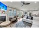 Bright living room with fireplace, ceiling fan, and access to dining and kitchen areas at 1814 Grovehurst Dr, Charleston, SC 29414