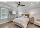 Serene main bedroom with a plank accent wall, tray ceiling, and neutral decor at 1814 Grovehurst Dr, Charleston, SC 29414