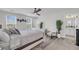 Bright and airy main bedroom with large windows, white furniture, and minimalist decor at 1814 Grovehurst Dr, Charleston, SC 29414
