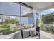 Relaxing screened patio with outdoor seating, view of the backyard, and ample natural light at 1814 Grovehurst Dr, Charleston, SC 29414