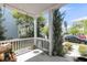 Inviting covered porch with hanging flower baskets, and outdoor seating at 1814 Grovehurst Dr, Charleston, SC 29414