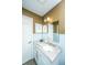 Bathroom featuring blue tile, granite counters, and white vanity at 206 Brailsford Rd, Summerville, SC 29485