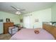 Bright bedroom featuring a ceiling fan and ample natural light from the windows at 206 Brailsford Rd, Summerville, SC 29485