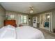 Comfortable bedroom featuring neutral colors, a ceiling fan, and ample natural light from the large window at 206 Brailsford Rd, Summerville, SC 29485
