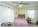 Cozy bedroom featuring a ceiling fan and ample natural light from the windows at 206 Brailsford Rd, Summerville, SC 29485