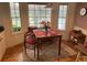 Cozy breakfast nook featuring a rustic table set for two next to the windows for natural light at 206 Brailsford Rd, Summerville, SC 29485