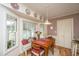 Charming breakfast nook with a window seat, table, and decoratively-plated cornice at 206 Brailsford Rd, Summerville, SC 29485