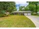 Charming brick home boasts a well-manicured lawn and a two-car attached garage at 206 Brailsford Rd, Summerville, SC 29485
