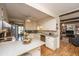 The kitchen offers white cabinets, stainless appliances, and an opening to the living room at 206 Brailsford Rd, Summerville, SC 29485