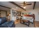 Inviting living room with wood floors, a comfortable couch, side chairs, and filled bookshelves at 206 Brailsford Rd, Summerville, SC 29485