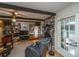 Living room features a brick fireplace, wood floors, and a comfortable chair with an adjacent doorway at 206 Brailsford Rd, Summerville, SC 29485
