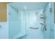 Shower with blue tile, built in seating, and handheld shower nozzle at 206 Brailsford Rd, Summerville, SC 29485
