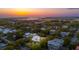Beautiful aerial view of waterfront community with sunset sky and lush greenery at 2114 Pettigrew St, Sullivans Island, SC 29482