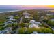 Scenic aerial shot of homes and streets near the ocean at sunset at 2114 Pettigrew St, Sullivans Island, SC 29482