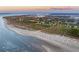 Stunning aerial view of Sullivan's Island beach and homes with ocean view at 2114 Pettigrew St, Sullivans Island, SC 29482