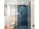 Modern bathroom with a glass door shower and a blue tiled interior at 2114 Pettigrew St, Sullivans Island, SC 29482