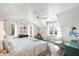 Bright bedroom with hardwood floors, natural light, stylish seating, and charming decor at 2114 Pettigrew St, Sullivans Island, SC 29482
