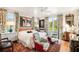 Spacious bedroom with hardwood floors, stylish seating, large windows and beautiful natural light at 2114 Pettigrew St, Sullivans Island, SC 29482