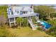 An amazing home with a beautiful swimming pool and outdoor seating area to entertain guests at 2114 Pettigrew St, Sullivans Island, SC 29482