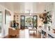 Open living room with hardwood floors, access to the balcony, and stylish seating at 2114 Pettigrew St, Sullivans Island, SC 29482